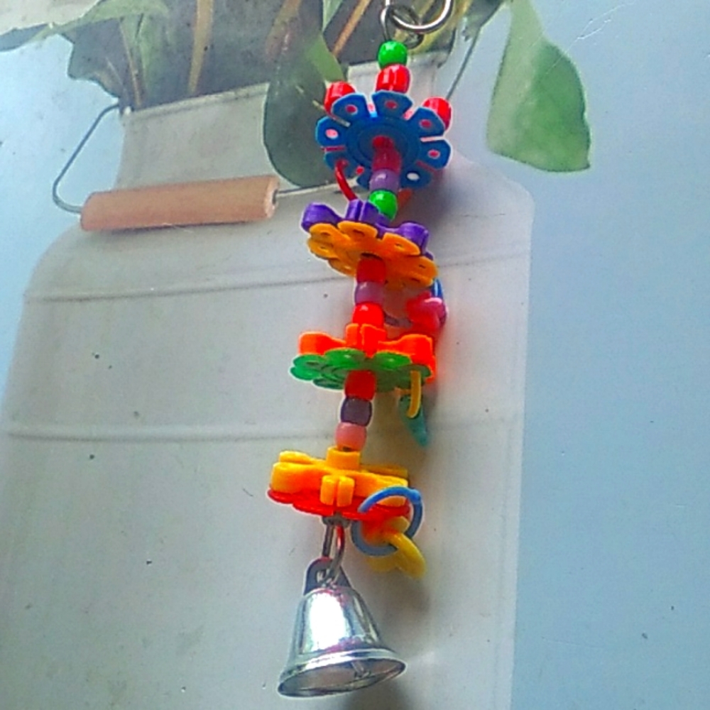 New in package Bird Toys colorful, has bells Beads and spinners